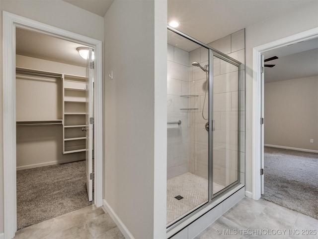 bathroom with a shower with door