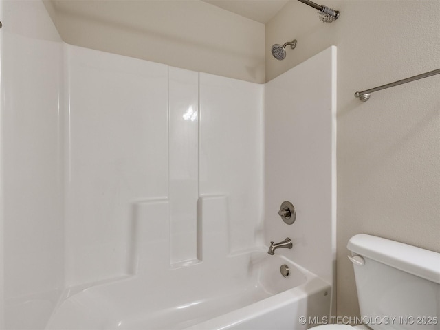 bathroom featuring toilet and shower / bathtub combination