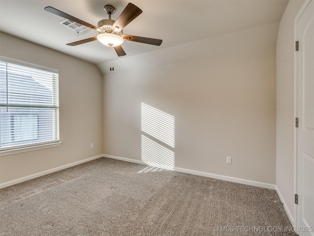 spare room with carpet floors, ceiling fan, and lofted ceiling