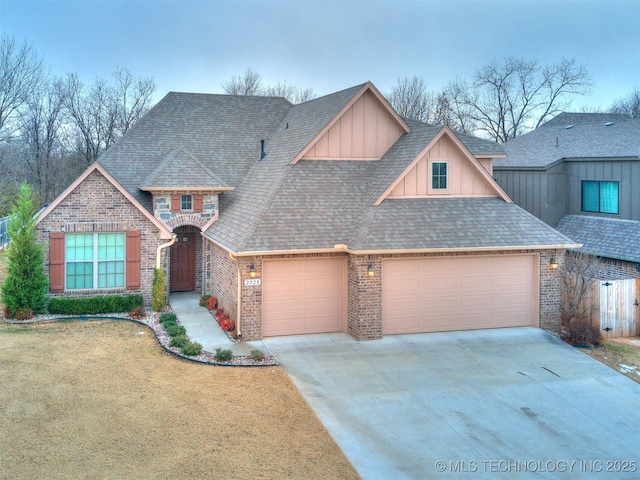 view of front of property featuring a front yard and a garage