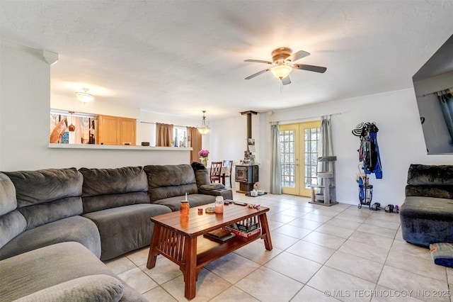 living room with ceiling fan, light tile patterned floors, and french doors