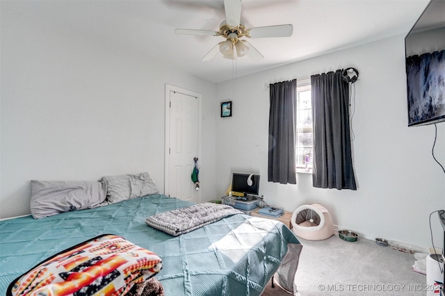 bedroom with ceiling fan and carpet flooring