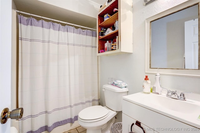 bathroom featuring toilet, a shower with shower curtain, and vanity