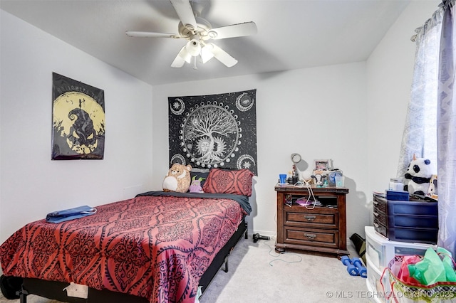 bedroom with ceiling fan and light colored carpet