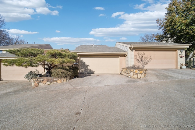 single story home featuring a garage