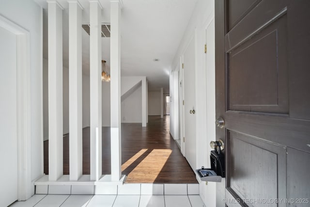 hallway with light tile patterned floors