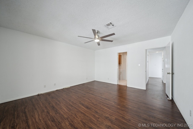 unfurnished room featuring dark wood-type flooring, a textured ceiling, and ceiling fan