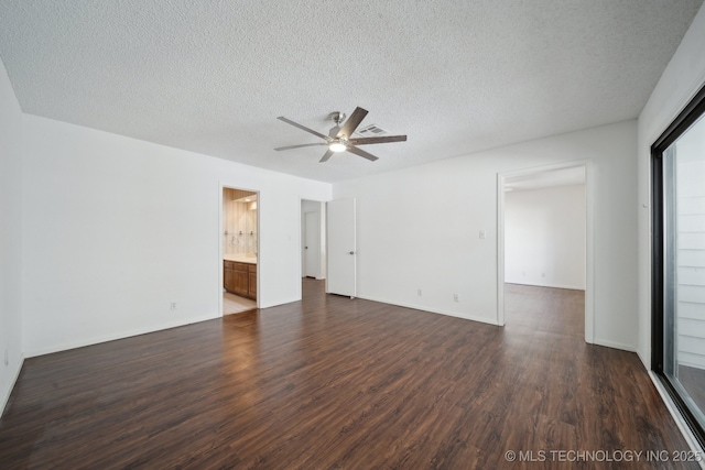 empty room featuring a textured ceiling, dark hardwood / wood-style floors, and ceiling fan