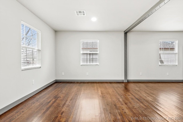 unfurnished room featuring dark wood-type flooring