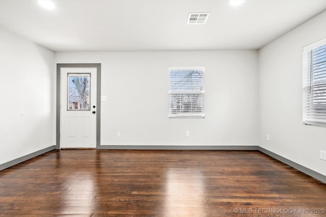 empty room featuring dark hardwood / wood-style floors