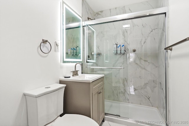 bathroom with walk in shower, vanity, and toilet