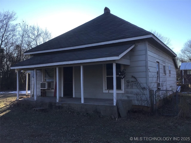 exterior space featuring cooling unit and covered porch