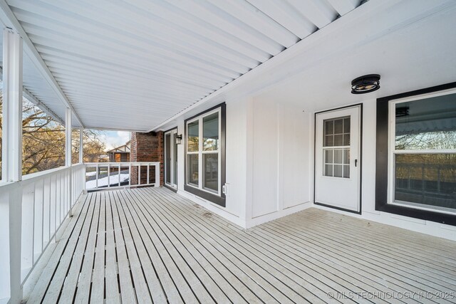 view of snow covered deck