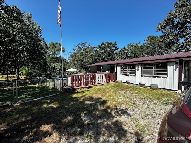 view of yard with a wooden deck