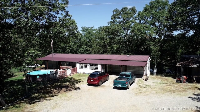 view of front of home featuring an outbuilding