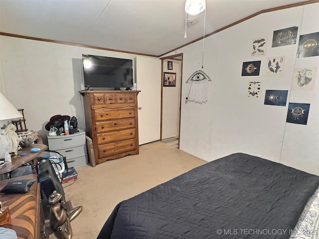 carpeted bedroom with crown molding and vaulted ceiling