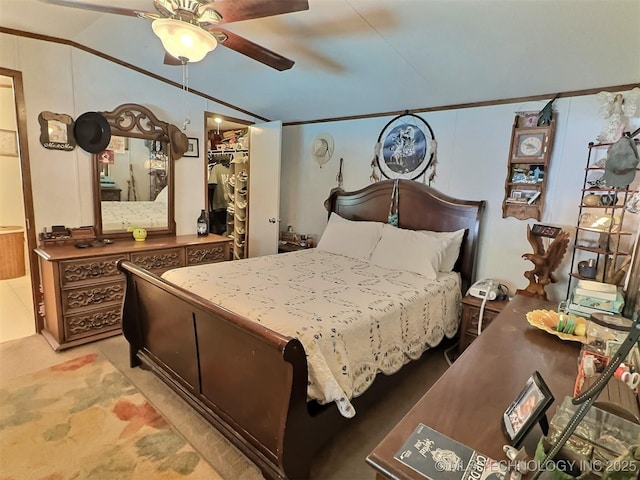 bedroom featuring ceiling fan, lofted ceiling, and crown molding