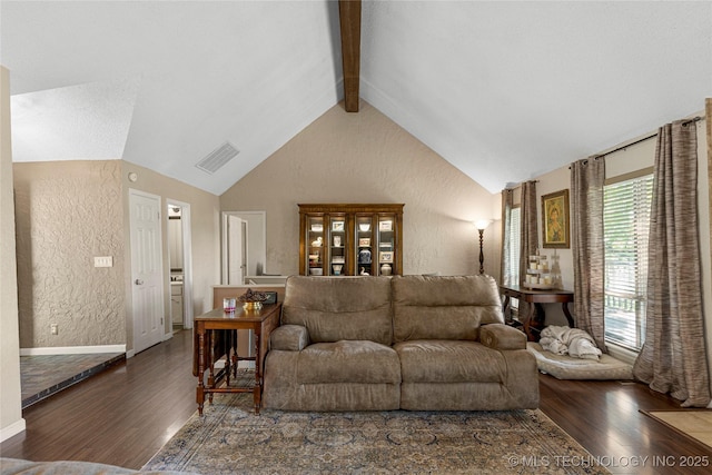 living room featuring dark hardwood / wood-style flooring and lofted ceiling with beams