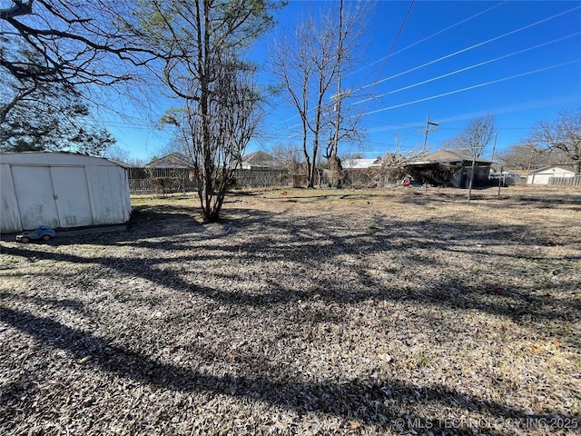 view of yard featuring a storage unit