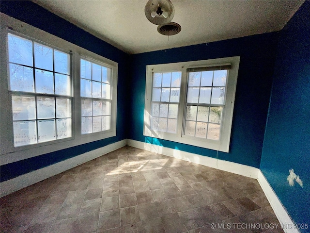 unfurnished dining area with a healthy amount of sunlight