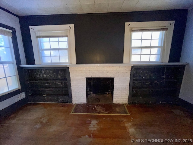 living room featuring a brick fireplace