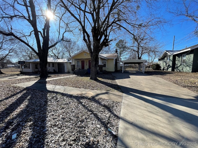 single story home featuring a carport