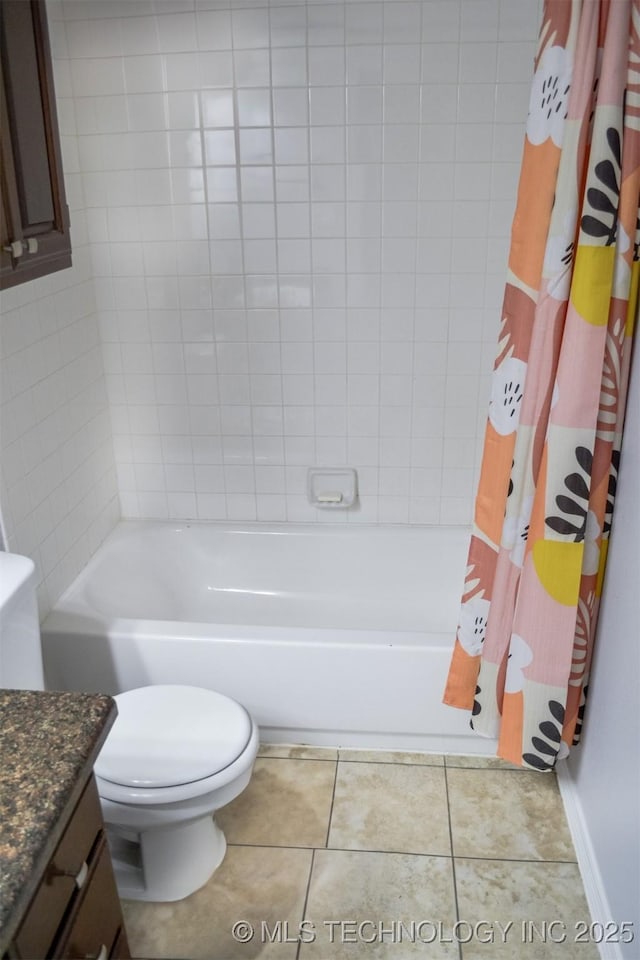 full bathroom featuring vanity, toilet, tile patterned flooring, and shower / tub combo