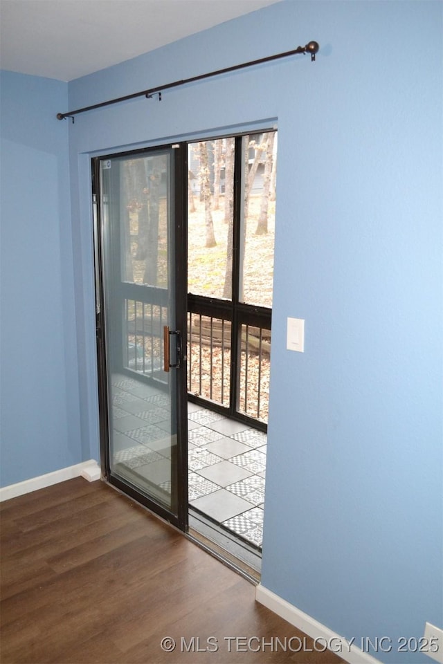 entryway with hardwood / wood-style flooring