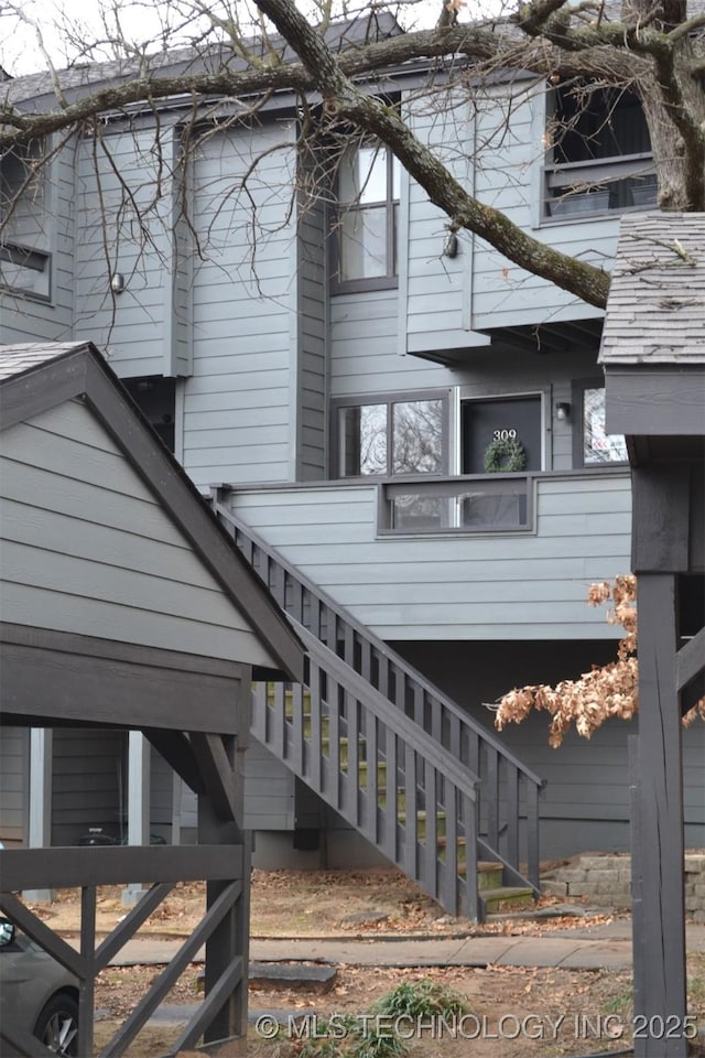 view of home's exterior with stairway