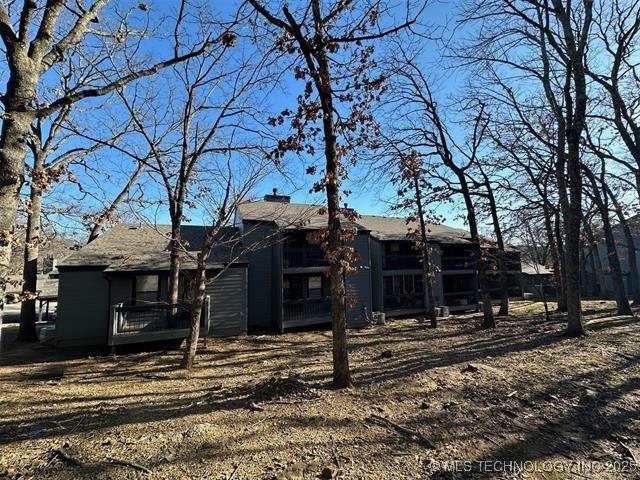 rear view of house with a chimney