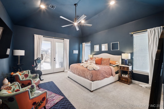 bedroom with carpet, ceiling fan, vaulted ceiling, access to outside, and french doors