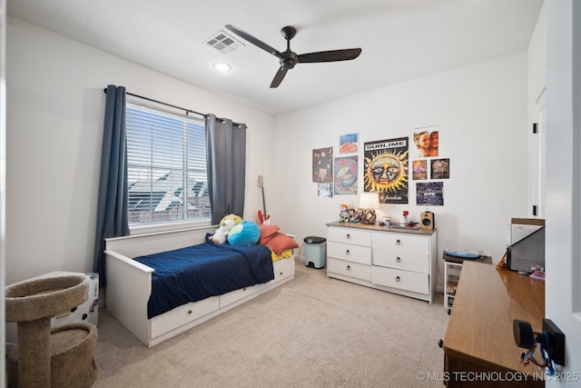 bedroom with ceiling fan and light colored carpet