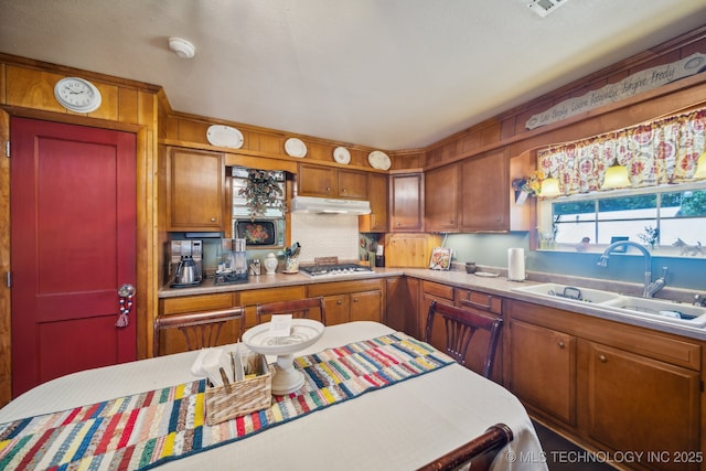 kitchen featuring stainless steel gas stovetop and sink