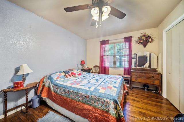 bedroom featuring dark hardwood / wood-style flooring, a closet, and ceiling fan