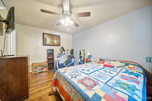 bedroom featuring ceiling fan and wood-type flooring