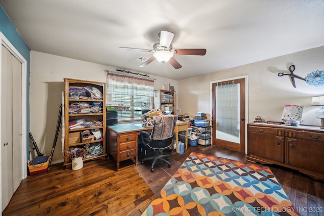 office space featuring ceiling fan and dark hardwood / wood-style flooring