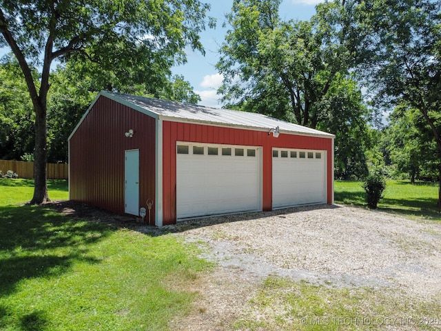 garage with a lawn