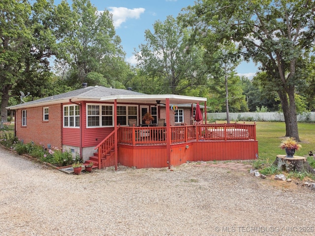 view of front of property featuring a wooden deck