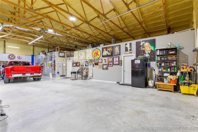 garage featuring black refrigerator