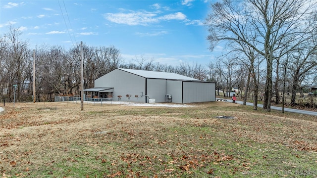 view of outbuilding featuring a lawn