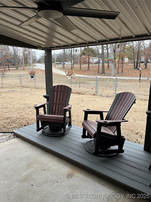 wooden deck featuring ceiling fan