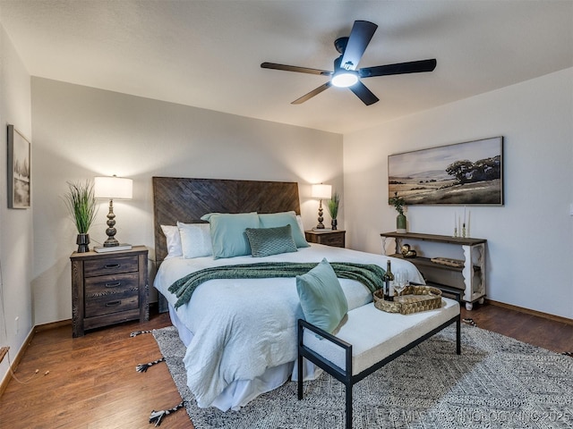 bedroom with ceiling fan and hardwood / wood-style floors