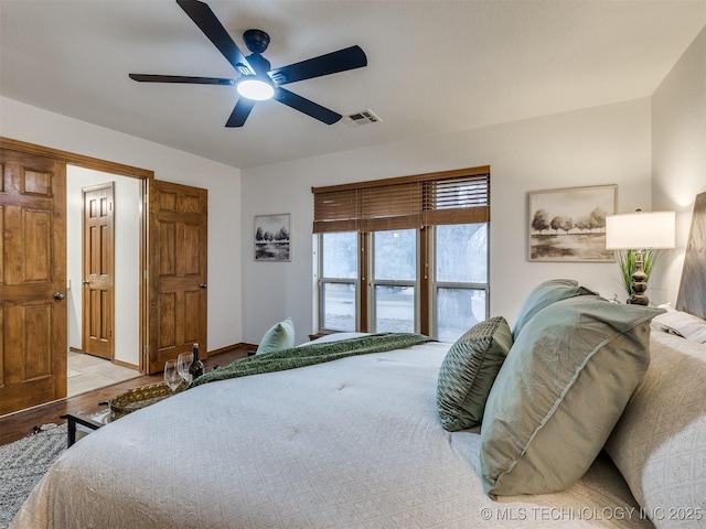 bedroom with ceiling fan and light wood-type flooring