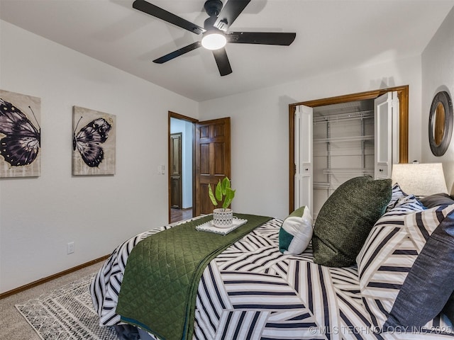 bedroom with ceiling fan, carpet, and a closet