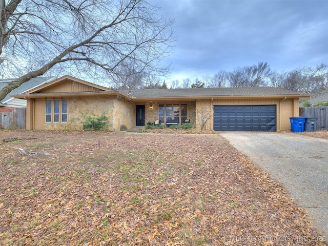 ranch-style home featuring a garage