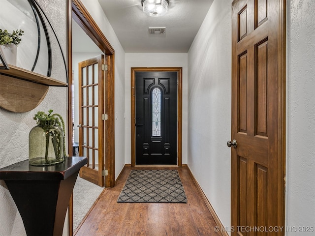 entryway featuring hardwood / wood-style flooring