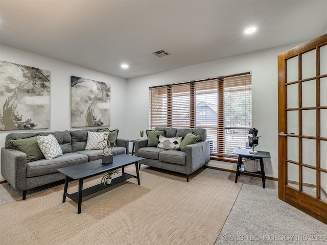 living room featuring light colored carpet