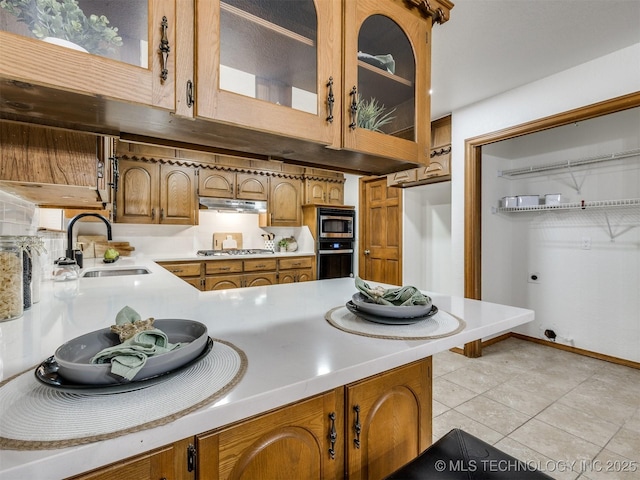 kitchen featuring sink, stainless steel appliances, and light tile patterned flooring