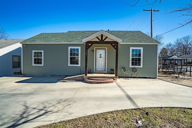 bungalow-style house with a patio area