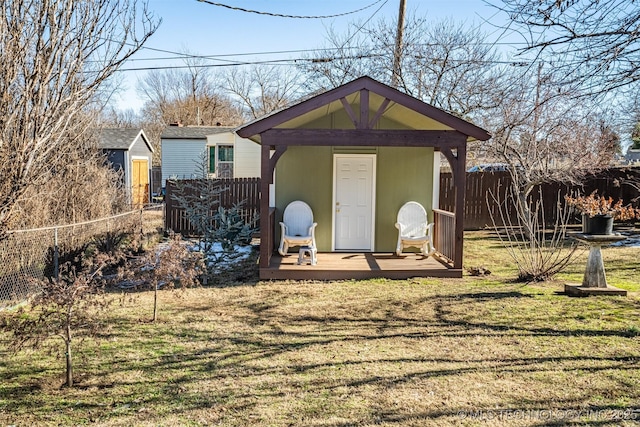 view of outbuilding featuring a yard